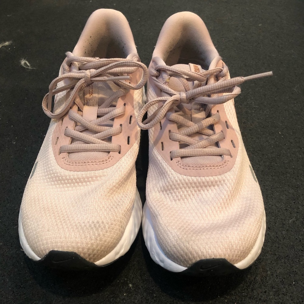 Baby pink Nike running shoe